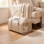 Cat resting inside the RoamNest carrier in a bright living room